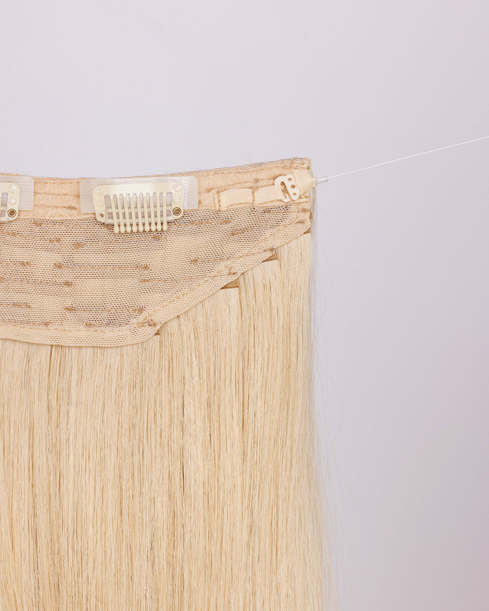 Close-up of BHBD hairband clip: hook & fishing line for adjustability.