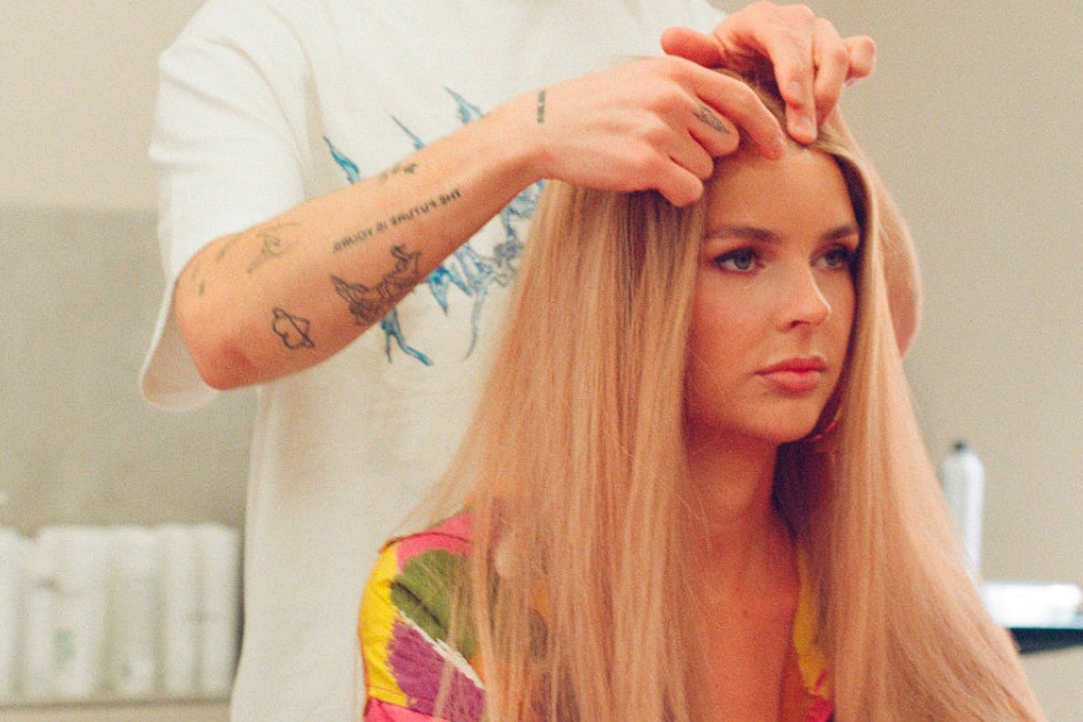 A woman at a BHBD wig consultation with a stylist.