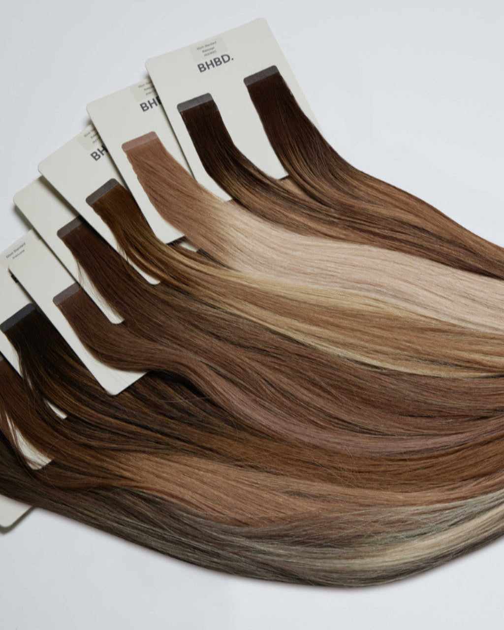 BHBD tape extensions in various shades of brown.