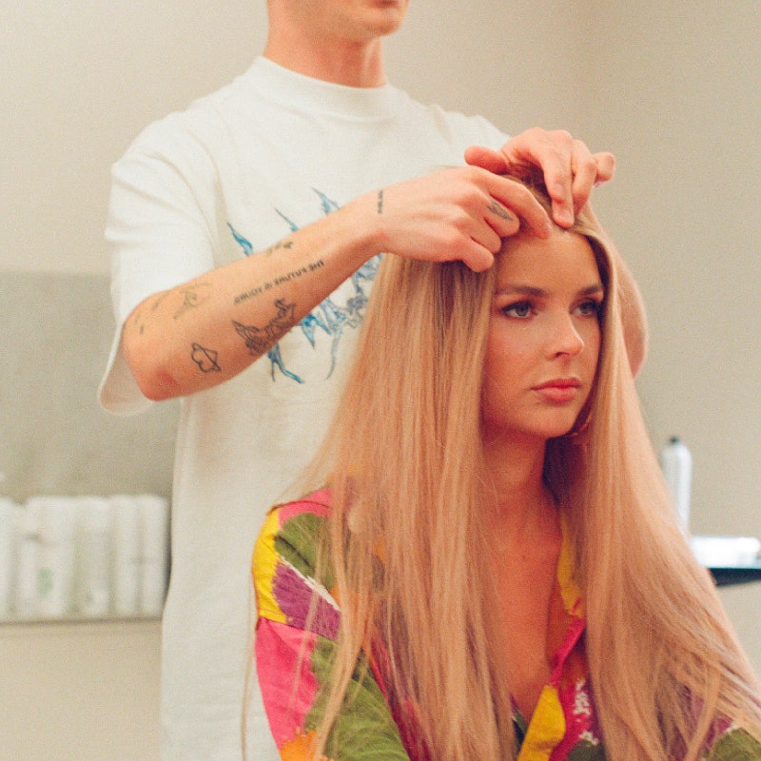 A woman at a BHBD wig consultation with a stylist.
